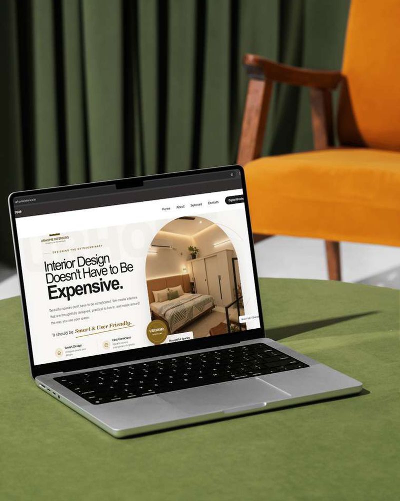 URHOME Interiors WordPress responsive website displayed on laptop in styled interior setting